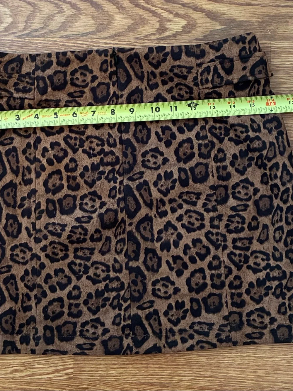 eesome Leopard-Print Mini Skirt in Brown and Black with Buckle Accents